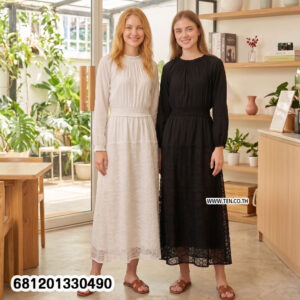 Minimalist monochrome crochet long dress in black and white with lace hem detail for summer resort wear