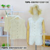 Floral lace cotton shorts for women in white and beige with tiered mesh detail, relaxed fit and beachwear aesthetic.