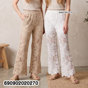Sheer floral lace resort pants in beige and white with large floral openwork and shaped hems