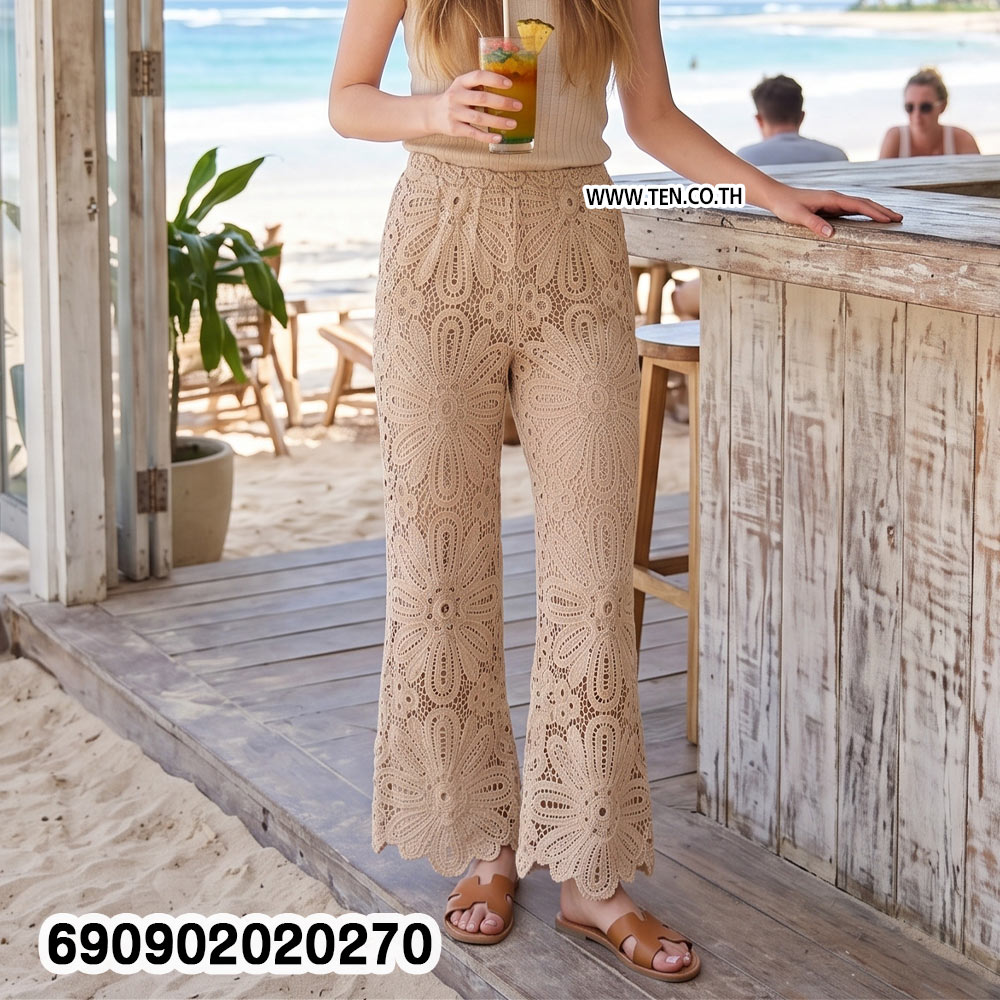 Sheer floral lace resort pants in beige and white with large floral openwork and shaped hems