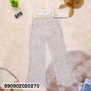 Sheer floral lace resort pants in beige and white with large floral openwork and shaped hems